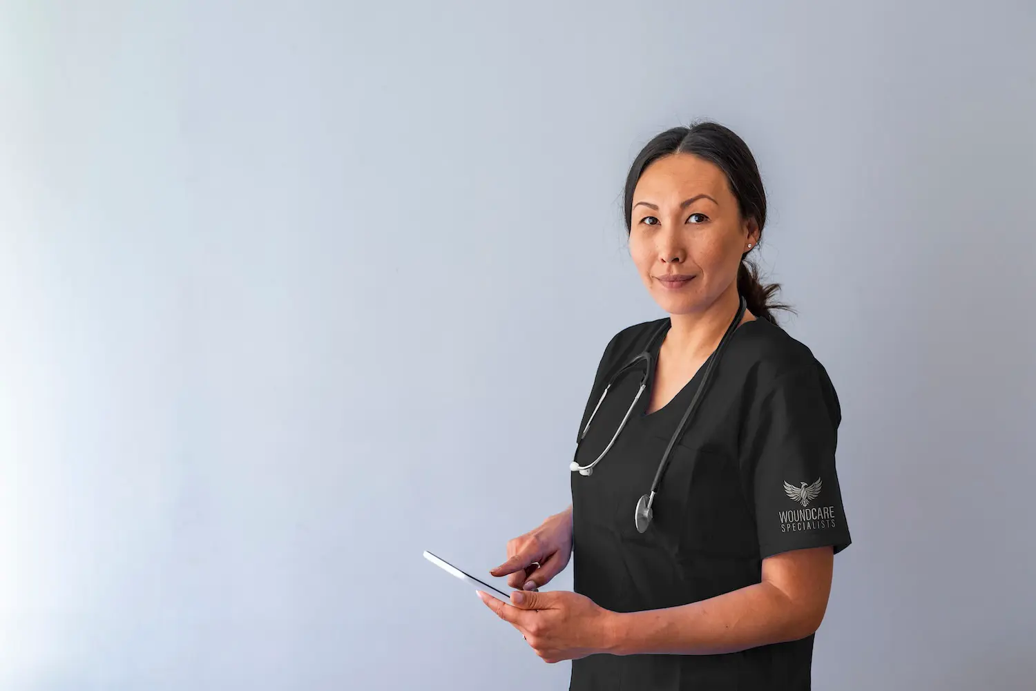Wound care clinician providing on-site treatment